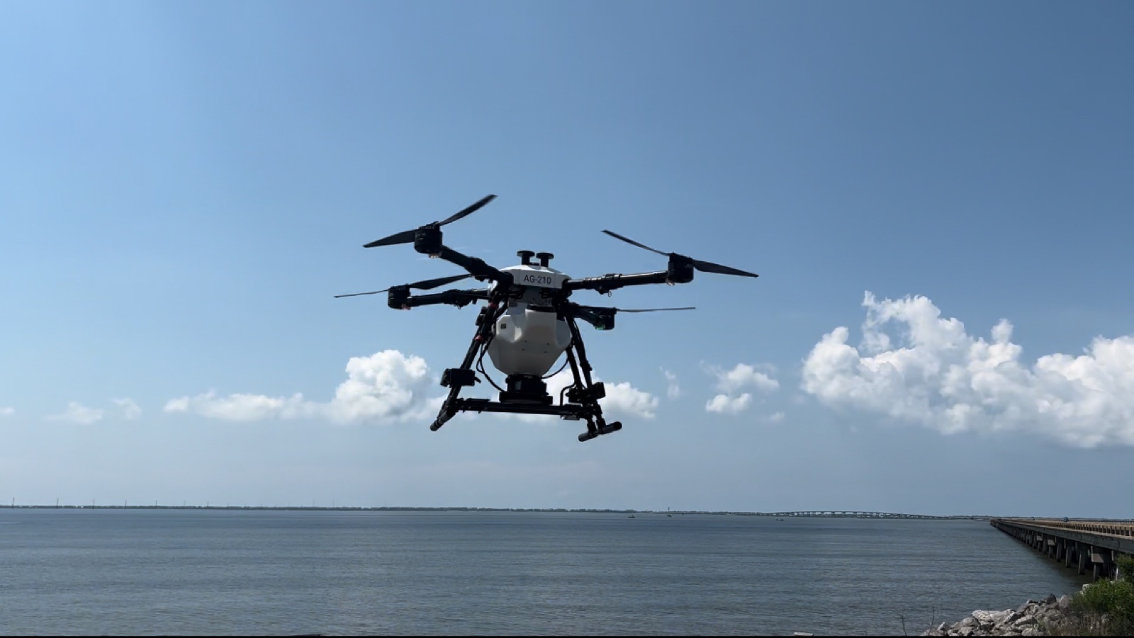 AeroTech UAV Hylio AG-210 heavy-lift drone in flight over Apalachicola Bay during oyster-seed deployment
