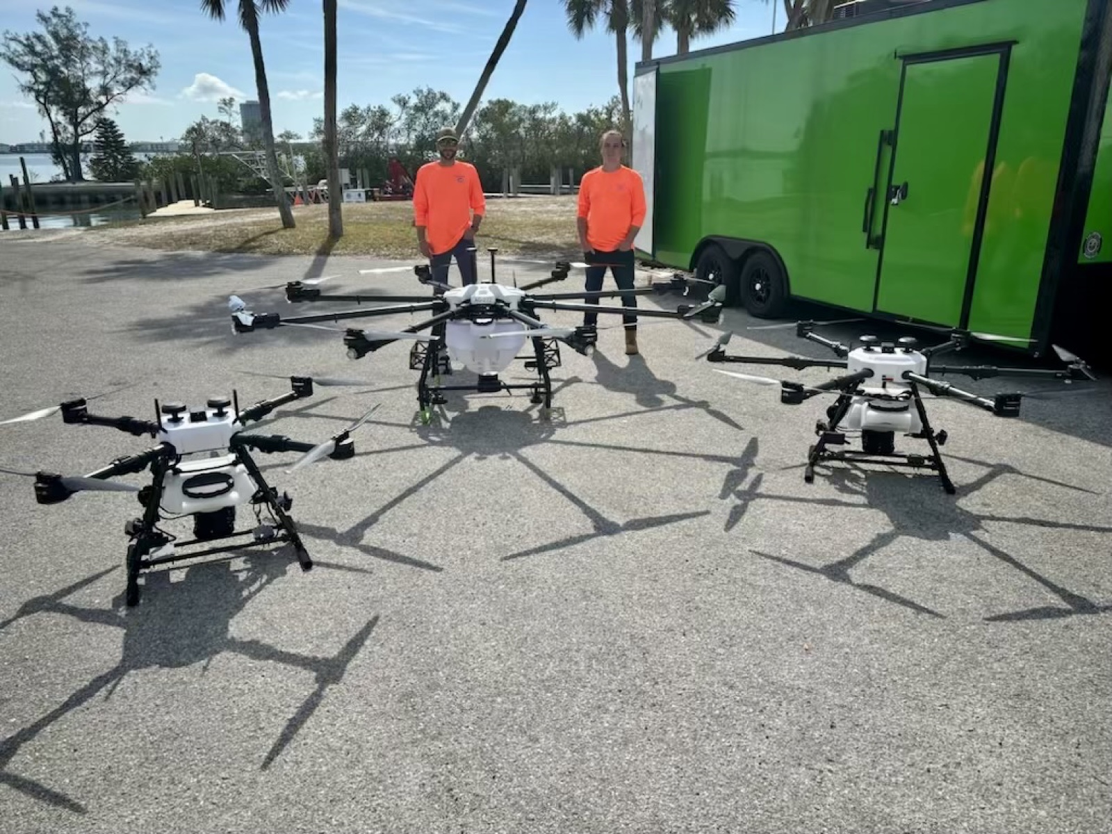 AeroTech UAV crew with their Hylio heavy-lift drone fleet and mobile command trailer