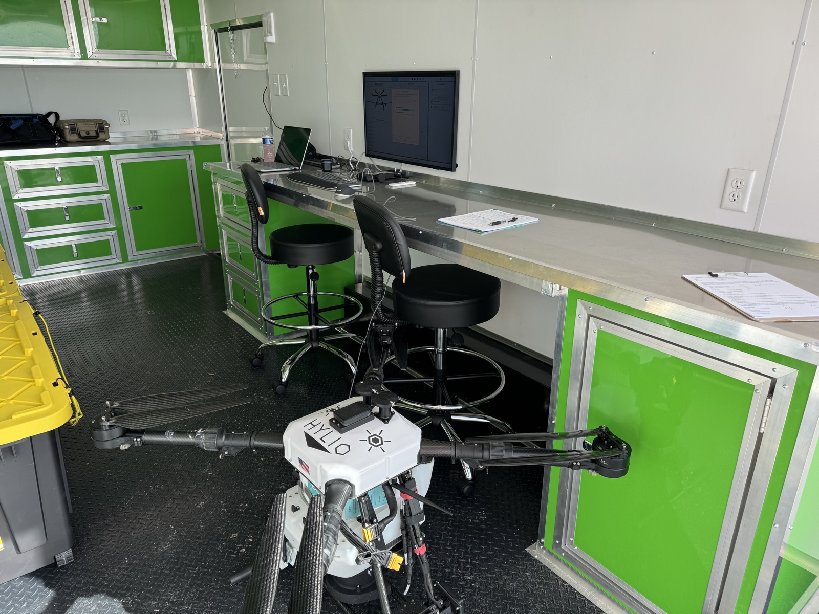 AeroTech UAV mobile command center — AgroSol mission-control station with a Hylio heavy-lift drone